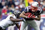 FOXBORO, MA - JANUARY 22:  Aaron Hernandez #81 of the New England Patriots runs with the ball against Bernard Pollard #31 of the Baltimore Ravens during their AFC Championship Game at Gillette Stadium on January 22, 2012 in Foxboro, Massachusetts.  (Photo by Jim Rogash/Getty Images)
