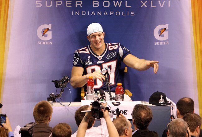 INDIANAPOLIS, IN - JANUARY 31:  Rob Gronkowski #87 of the New England Patriots answers questions from the media during Media Day ahead of Super Bowl XLVI against the New York Giants at Lucas Oil Stadium on January 31, 2012 in Indianapolis, Indiana.  (Photo by Michael Heiman/Getty Images)
