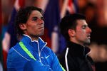 MELBOURNE, AUSTRALIA - JANUARY 29:  Rafael Nadal of Spain and Novak Djokovic of Serbia  listen during the presentation ceremony after Djokovic won the men's final match against  during day fourteen of the 2012 Australian Open at Melbourne Park on January 29, 2012 in Melbourne, Australia.  (Photo by Clive Brunskill/Getty Images)