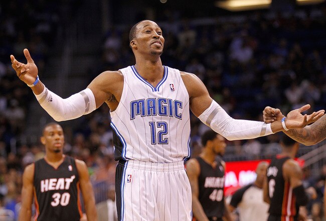 ORLANDO, FL - DECEMBER 21: Dwight Howard #12 of the Orlando Magic argues a call during a preseason game against the Miami Heat at Amway Center on December 21, 2011 in Orlando, Florida. NOTE TO USER: User expressly acknowledges and agrees that, by downloading and/or using this Photograph, User is consenting to the terms and conditions of the Getty Images License Agreement.  (Photo by Mike Ehrmann/Getty Images)