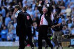 MANCHESTER, UNITED KINGDOM - APRIL 17:  Manchester United Manager Sir Alex Ferguson celebrates as Manchester City Manager Roberto Mancini looks on during the Barclays Premier League match between Manchester City and Manchester United at the City of Manchester Stadium on April 17, 2010 in Manchester, England. (Photo by Shaun Botterill/Getty Images)