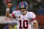 SAN FRANCISCO, CA - JANUARY 22:  Eli Manning #10 of the New York Giants celebrates after he threw a 6-yard touchdown pass to Bear Pascoe #86 against the San Francisco 49ers in the second quarter during the NFC Championship Game at Candlestick Park on January 22, 2012 in San Francisco, California.  (Photo by Jamie Squire/Getty Images)