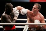 MOSCOW - DECEMBER 10:  Oleg Maskaev (R) of Russia in action against Peter Okhello of Uganda during the WBC Heavyweight title fight on December 10, 2006 in Moscow, Russia. (Photo by Dima Korotayev/Epsilon/Getty Images)