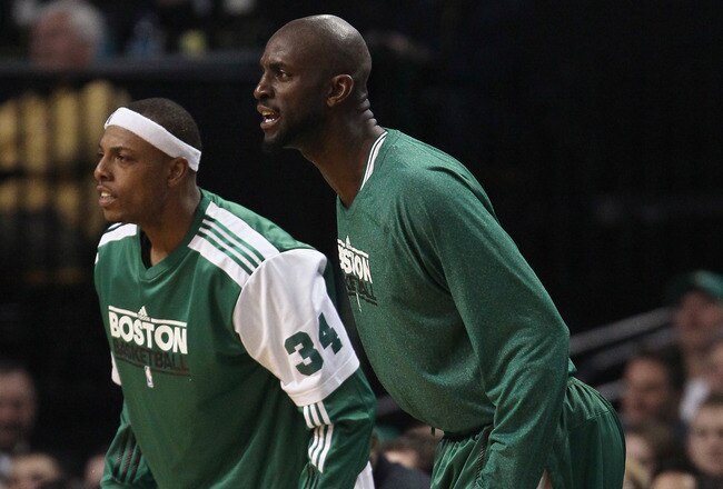 BOSTON, MA - JANUARY 25:  Paul Pierce #34 and Kevin Garnett #5 of the Boston Celitcs cheer on their teammates in the second half against the Cleveland Cavaliers on January 25, 2011 at the TD Garden in Boston, Massachusetts. The Celtics defeated the Cavaliers 112-95.  NOTE TO USER: User expressly acknowledges and agrees that, by downloading and/or using this Photograph, User is consenting to the terms and conditions of the Getty Images License Agreement.  (Photo by Elsa/Getty Images)