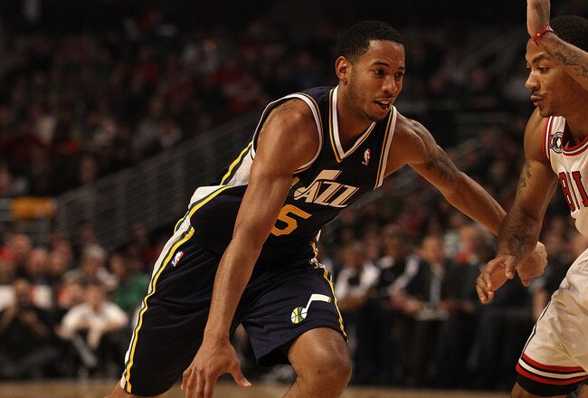 CHICAGO, IL - MARCH 12: Devin Harris #5 of the Utah Jazz drives against Derrick Rose #1 of the Chicago Bulls at the United Center on March 12, 2011 in Chicago, Illinois. The Bulls defeated the Jazz 118-100. NOTE TO USER: User expressly acknowledges and agrees that, by downloading and/or using this photograph, User is consenting to the terms and conditions of the Getty Images License Agreement. (Photo by Jonathan Daniel/Getty Images)