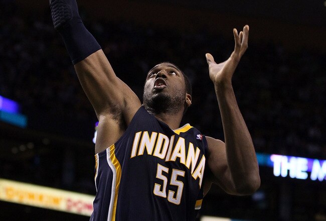 BOSTON, MA - JANUARY 06:  Roy Hibbert #55 of the Indiana Pacers grabs the rebound in the second half against the Boston Celtics on January 6, 2012 at TD Garden in Boston, Massachusetts. The Indiana Pacers defeated the Boston Celtics 87-74. NOTE TO USER: User expressly acknowledges and agrees that, by downloading and or using this photograph, User is consenting to the terms and conditions of the Getty Images License Agreement.  (Photo by Elsa/Getty Images)