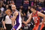 PHOENIX, AZ - JANUARY 13:  Marcin Gortat #4 of the Phoenix Suns handles the ball during the NBA game against the New Jersey Nets at US Airways Center on January 13, 2012 in Phoenix, Arizona. The Nets defeated the Suns 110-103.   NOTE TO USER: User expressly acknowledges and agrees that, by downloading and or using this photograph, User is consenting to the terms and conditions of the Getty Images License Agreement.  (Photo by Christian Petersen/Getty Images)