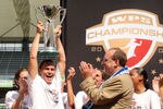 CARSON, CA - AUGUST 22:  Captain and Head Coach Christie Rampone #3 of the New Jersey Blue Sky FC hoist the trophy in front of Thomas Hofsetter, President and CEO in celebration of a 1-0 win over the Los Angeles Sol at The Home Depot Center on August 22, 2009 in Carson, California.  (Photo by Harry How/Getty Images)
