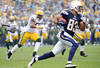 SAN DIEGO, CA - NOVEMBER 06:   Vincent Jackson #83 of the San Diego Chargers runs as Desmond Bishop #55 of the Green Bay Packers chases after a catch during the first quarter at Qualcomm Stadium on November 6, 2011 in San Diego, California.  (Photo by Harry How/Getty Images)
