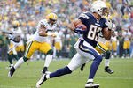 SAN DIEGO, CA - NOVEMBER 06:   Vincent Jackson #83 of the San Diego Chargers runs as Desmond Bishop #55 of the Green Bay Packers chases after a catch during the first quarter at Qualcomm Stadium on November 6, 2011 in San Diego, California.  (Photo by Harry How/Getty Images)