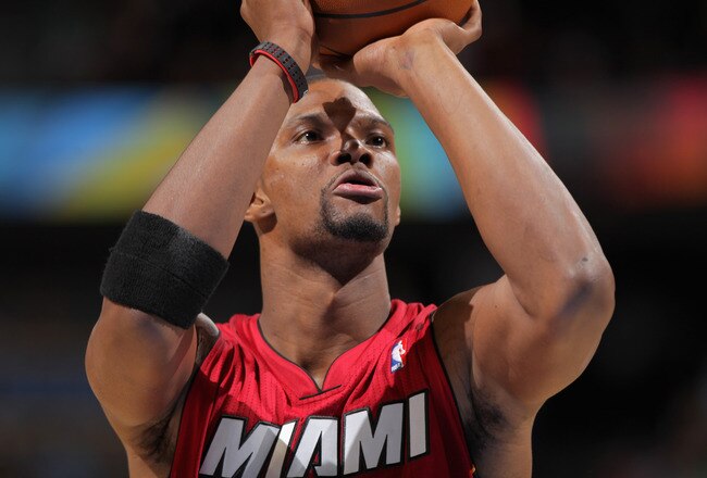 DENVER, CO - JANUARY 13:  Chris Bosh #1 of the Miami Heat takes a free throw against the Denver Nuggets at the Pepsi Center on January 13, 2012 in Denver, Colorado. The Nuggets defeated the Heat 117-104. NOTE TO USER: User expressly acknowledges and agrees that, by downloading and or using this photograph, User is consenting to the terms and conditions of the Getty Images License Agreement.  (Photo by Doug Pensinger/Getty Images)