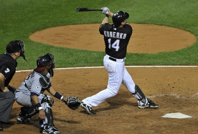 CHICAGO, IL - SEPTEMBER 08:  Paul Konerko #14 of the Chicago White Sox hits a grand slam home run in the seventh inning against the Cleveland Indians on September 08, 2011 at U.S. Cellular Field in Chicago, Illinois.  (Photo by David Banks/Getty Images)