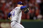 ST LOUIS, MO - OCTOBER 28:  Matt Harrison #54 of the Texas Rangers pitches in the fourth inning during Game Seven of the MLB World Series against the St. Louis Cardinals at Busch Stadium on October 28, 2011 in St Louis, Missouri.  (Photo by Ezra Shaw/Getty Images)