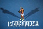 MELBOURNE, AUSTRALIA - JANUARY 28:  Victoria Azarenka of Belarus poses with the Daphne Akhurst Memorial Cup after winning her women's final match against Maria Sharapova of Russia, and being named world number one, during day thirteen of the 2012 Australian Open at Melbourne Park on January 28, 2012 in Melbourne, Australia.  (Photo by Mark Dadswell/Getty Images)