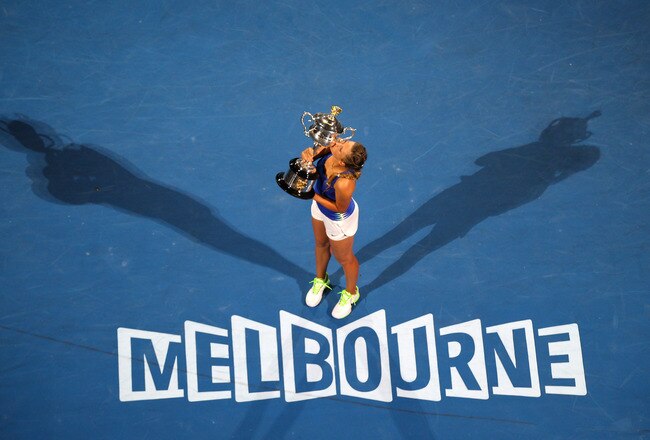 MELBOURNE, AUSTRALIA - JANUARY 28:  Victoria Azarenka of Belarus poses with the Daphne Akhurst Memorial Cup after winning her women's final match against Maria Sharapova of Russia, and being named world number one, during day thirteen of the 2012 Australian Open at Melbourne Park on January 28, 2012 in Melbourne, Australia.  (Photo by Mark Dadswell/Getty Images)