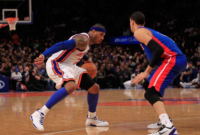NEW YORK, NY - JANUARY 31:  Carmelo Anthony #7 of the New York Knicks drives against Austin Daye #5 of the Detroit Pistons at Madison Square Garden on January 31, 2012 in New York City.  NOTE TO USER: User expressly acknowledges and agrees that, by downloading and or using this photograph, User is consenting to the terms and conditions of the Getty Images License Agreement. (Photo by Chris Trotman/Getty Images)
