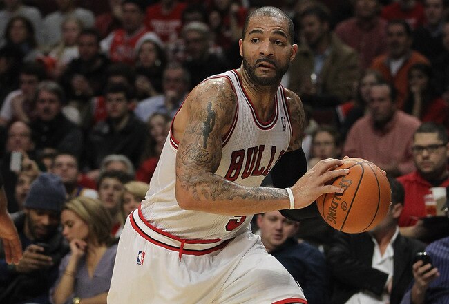 CHICAGO, IL - JANUARY 03:  Carlos Boozer #5 of the Chicago Bulls moves against of the Atlanta Hawks at the United Center on January 3, 2012 in Chicago, Illinois. The Bulls defeated the Hawks 76-74. NOTE TO USER: User expressly acknowledges and agrees that, by downloading and or using this photograph, User is consenting to the terms and conditions of the Getty Images License Agreement.  (Photo by Jonathan Daniel/Getty Images)