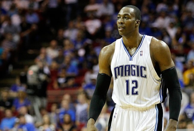 ORLANDO, FL - MAY 26:  Dwight Howard #12 of the Orlando Magic looks on against the Boston Celtics in Game Five of the Eastern Conference Finals during the 2010 NBA Playoffs at Amway Arena on May 26, 2010 in Orlando, Florida.  NOTE TO USER: User expressly acknowledges and agrees that, by downloading and/or using this Photograph, user is consenting to the terms and conditions of the Getty Images License Agreement.  (Photo by Kevin C. Cox/Getty Images)