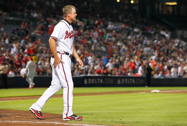 ATLANTA, GA - SEPTEMBER 26:  Chipper Jones #10 of the Atlanta Braves favors his right leg after the bottom of the sixth inning against the Philadelphia Phillies at Turner Field on September 26, 2011 in Atlanta, Georgia.  (Photo by Kevin C. Cox/Getty Images)