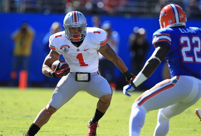 JACKSONVILLE, FL - JANUARY 02:  Dan Herron #1 of Ohio State Buckeyes runs upfield at the TaxSlayer.com Gator Bowl against the Florida Gators at EverBank Field on January 2, 2012 in Jacksonville, Florida.  (Photo by Scott Halleran/Getty Images)