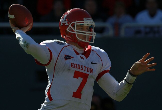 DALLAS, TX - JANUARY 02:  Case Keenum #7 of the Houston Cougars throws against the Penn State Nittany Lions during the TicketCity Bowl at Cotton Bowl Stadium on January 2, 2012 in Dallas, Texas.  (Photo by Ronald Martinez/Getty Images)