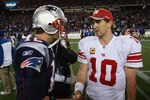 FOXBORO, MA - NOVEMBER 6:    Tom Brady #12 of the New England Patriots congratulates  Eli Manning #10 of the New York Giants after the New York Giants 24-20 win on November 6, 2011 in Foxboro, Massachusetts. (Photo by Jim Rogash/Getty Images)