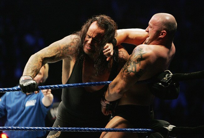 SYDNEY, AUSTRALIA - JUNE 15:  The Undertaker (L) pushes Bam Neely into the corner during WWE Smackdown at Acer Arena on June 15, 2008 in Sydney, Australia.  (Photo by Gaye Gerard/Getty Images)