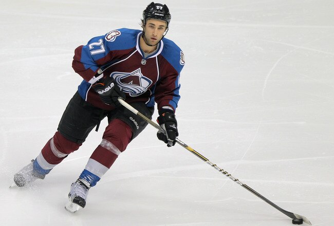 DENVER, CO - NOVEMBER 18:  Kyle Quincey #27 of the Colorado Avalanche controls the puck against the Dallas Stars at the Pepsi Center on November 18, 2011 in Denver, Colorado.  (Photo by Doug Pensinger/Getty Images)