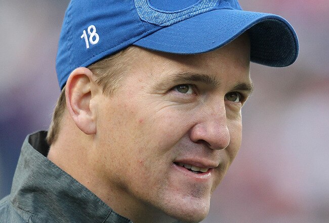 FOXBORO, MA - DECEMBER 4:    Peyton Manning #18 of the Indianapolis Colts watches the action in the first half against the New England Patriots at Gillette Stadium on December 4, 2011 in Foxboro, Massachusetts. (Photo by Jim Rogash/Getty Images)