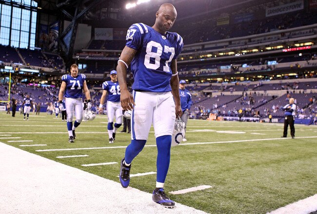 INDIANAPOLIS, IN - NOVEMBER 27:  Reggie Wayne #87 of the Indianapolis Colts walks off of the field after the Colts lost 27-19 to Carolina Panthers at Lucas Oil Stadium on November 27, 2011 in Indianapolis, Indiana.  (Photo by Andy Lyons/Getty Images)
