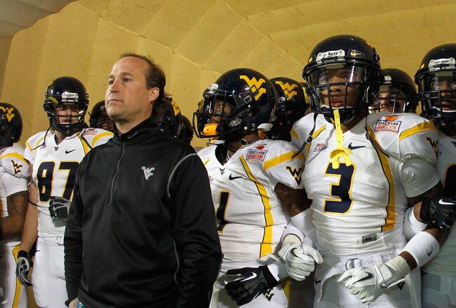 MIAMI GARDENS, FL - JANUARY 04:  (L-R) Head coach Dana Holgorsen, Tavon Austin #1 and Stedman Bailey #3 of the West Virginia Mountaineers wait in the tunnel prior to running onto the field to take on the Clemson Tigers during the Discover Orange Bowl at Sun Life Stadium on January 4, 2012 in Miami Gardens, Florida.  (Photo by Mike Ehrmann/Getty Images)