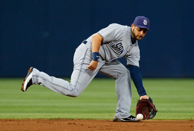 ATLANTA, GA - JUNE 01:  Jason Bartlett #8 of the San Diego Padres scoops up a ground ball hit by Jordan Schafer #1 of the Atlanta Braves in the fourth inning at Turner Field on June 1, 2011 in Atlanta, Georgia.  (Photo by Kevin C. Cox/Getty Images)