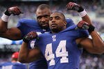 EAST RUTHERFORD, NJ - JANUARY 08:  (L-R) Brandon Jacobs #27 and Ahmad Bradshaw #44 of the New York Giants celebrates after the GIants won 24-2 against the Atlanta Falcons during their NFC Wild Card Playoff game at MetLife Stadium on January 8, 2012 in East Rutherford, New Jersey.  (Photo by Nick Laham/Getty Images)