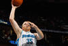 NEW ORLEANS, LA - JANUARY 06:  Chris Kaman #35 of the New Orleans Hornets shoots the ball over Ty Lawson #3 of the Denver Nuggets at the New Orleans Arena on January 6, 2012 in New Orleans, Louisiana.  NOTE TO USER: User expressly acknowledges and agrees that, by downloading and or using this photograph, User is consenting to the terms and conditions of the Getty Images License Agreement.  (Photo by Chris Graythen/Getty Images)