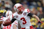 ANN ARBOR, MI - NOVEMBER 19:  Taylor Martinez #3 of the Nebraska Cornhuskers throws a first quarter pass while playing the Michigan Wolverines at Michigan Stadium on November 19, 2011 in Ann Arbor, Michigan. (Photo by Gregory Shamus/Getty Images)