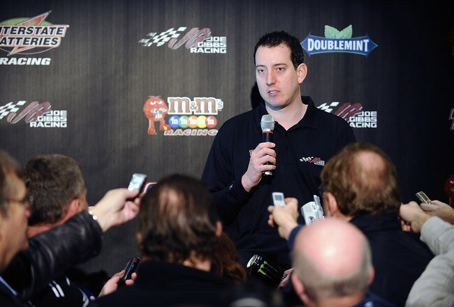 CONCORD, NC - JANUARY 23:  Kyle Busch, driver of the #18 M&M's Toyota, speaks with the media during the 2012 NASCAR Sprint Cup Series Media Tour hosted by Charlotte Motor Speedway on January 23, 2012 in Concord, North Carolina.  (Photo by Jared C. Tilton/Getty Images for NASCAR)