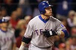ST LOUIS, MO - OCTOBER 20:  Josh Hamilton #32 of the Texas Rangers hits an RBI sacrifice fly ball to tie the game in the ninth inning during Game Two of the MLB World Series against the St. Louis Cardinals at Busch Stadium on October 20, 2011 in St Louis, Missouri.  (Photo by Ezra Shaw/Getty Images)