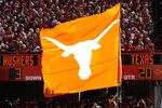 LINCOLN, NE - OCTOBER 16: The Texas Longhorn flag runs across the Nebraska Cornhusker endzone after their final score during second half action of their game at Memorial Stadium on October 16, 2010 in Lincoln, Nebraska. Texas Defeated Nebraska 20-13. (Photo by Eric Francis/Getty Images)
