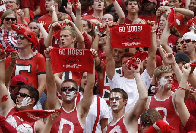 FAYETTEVILLE - SEPTEMBER 25: Arkansas Razorbacks fans cheer during the game against the Alabama Crimson Tide at Donald W. Reynolds Razorback Stadium on September 25, 2010 in Fayetteville, Arkansas. Alabama won 24-20. (Photo by Joe Robbins/Getty Images)
