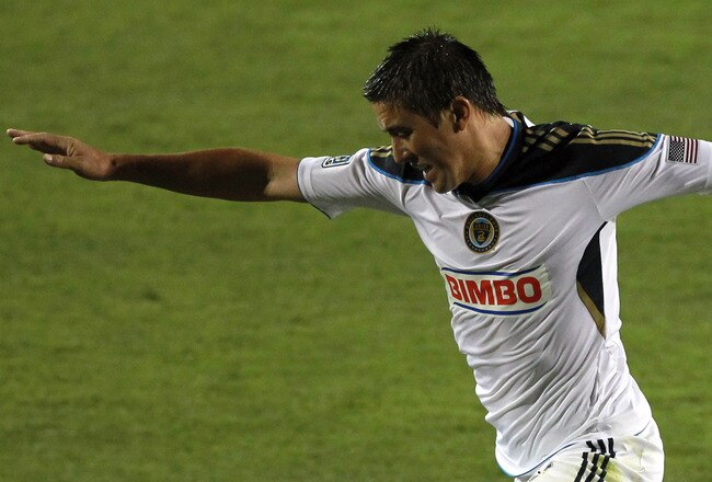 SANTA CLARA, CA - JULY 09:  Kyle Nakazawa #13 of the Philadelphia Union jumps over a diving Bobby Burling #2 of the San Jose Earthquakes at Buck Shaw Stadium on July 9, 2011 in Santa Clara, California.  (Photo by Ezra Shaw/Getty Images)