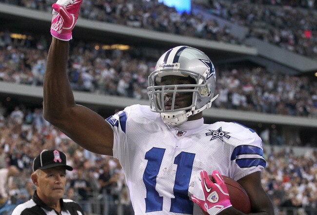 ARLINGTON, TX - OCTOBER 10:  Wide receiver Roy Williams #11 of the Dallas Cowboys celebrates after making a six yard touchdown reception in the second quarter against the Tennessee Titans at Cowboys Stadium on October 10, 2010 in Arlington, Texas.  (Photo by Stephen Dunn/Getty Images)