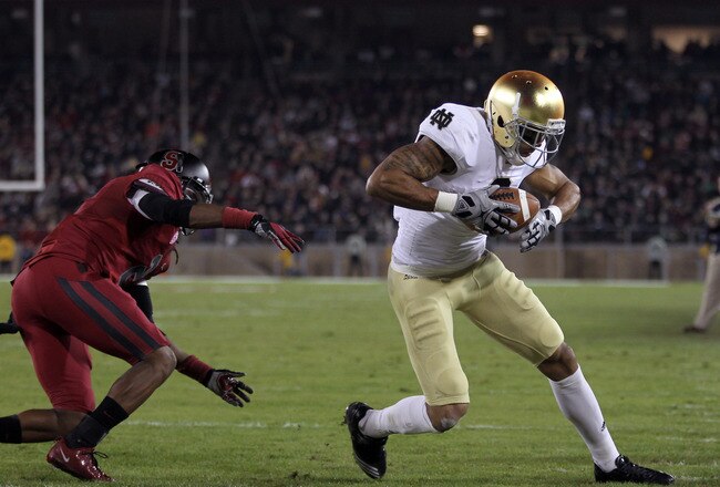STANFORD, CA - NOVEMBER 26:  Michael Floyd #3 of the Notre Dame Fighting Irish gets past Wayne Lyons #2 of the Stanford Cardinal to score a touchdown at Stanford Stadium on November 26, 2011 in Stanford, California.  (Photo by Ezra Shaw/Getty Images)