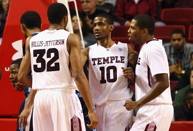 PHILADELPHIA, PA - DECEMBER 10:  (L-R) Rahlir Hollis-Jefferson #32, Ramone Moore #10 and Khalif Wyatt #1 of the Temple Owls celebrate a play against the Villanova Wildcats at the Liacouras Center on December 10, 2011 in Philadelphia, Pennsylvania.  (Photo by Chris Chambers/Getty Images)