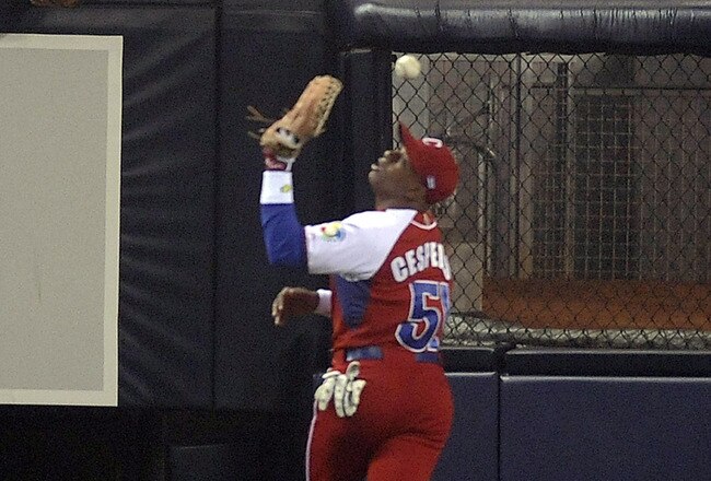 SAN DIEGO - MARCH 18: Yoennis Cespedes #51 of Cuba drops a fly ball to allow two runs to Japan during the 2009 World Baseball Classic Round 2 Pool 1 Game 5 on March 18, 2009 at Petco Park in San Diego, California.  (Photo by Kevork Djansezian/Getty Images)