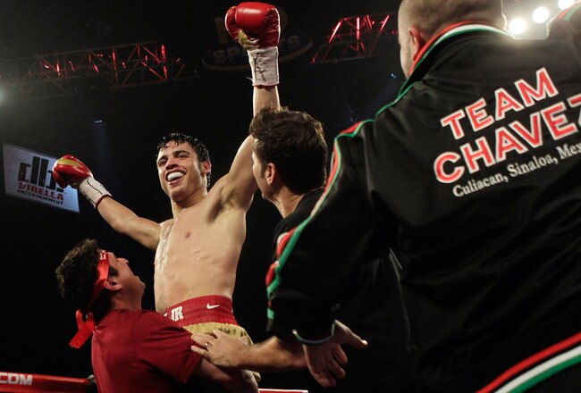 HOUSTON - NOVEMBER 19:  Julio Chavez Jr. is lifted up by his corner after stopping Peter Manredo Jr. with TKO in the fifth round to retain his World Middleweight  Championship at Reliant Arena at Reliant Park on November 19, 2011 in Houston, Texas.  (Photo by Bob Levey/Getty Images)