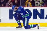 VANCOUVER, CANADA - JANUARY 31: Daniel Sedin #22 of the Vancouver Canucks celebrates with Sami Salo #6 after scoring a goal to defeat the Chicago Blackhawks 3-2 in overtime during NHL action on January 31, 2012 at Rogers Arena in Vancouver, British Columbia, Canada.  (Photo by Rich Lam/Getty Images)