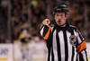 BOSTON, MA - MAY 17:  Referee Kelly Sutherland #11 makes a call in Game Two of the Eastern Conference Finals between the Boston Bruins and the Tampa Bay Lightning during the 2011 NHL Stanley Cup Playoffs at TD Garden on May 17, 2011 in Boston, Massachusetts.  (Photo by Bruce Bennett/Getty Images)