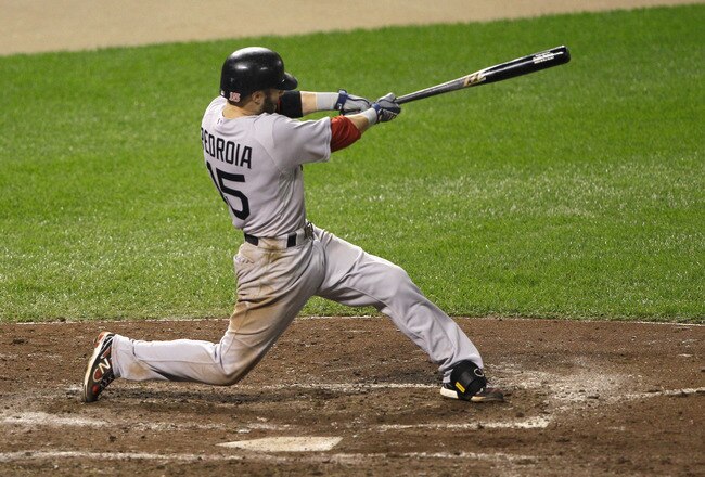 BALTIMORE, MD - SEPTEMBER 28: Dustin Pedroia #15 of the Boston Red Sox follows his solo home run against the Baltimore Orioles during the fifth inning at Oriole Park at Camden Yards on September 28, 2011 in Baltimore, Maryland.  (Photo by Rob Carr/Getty Images)