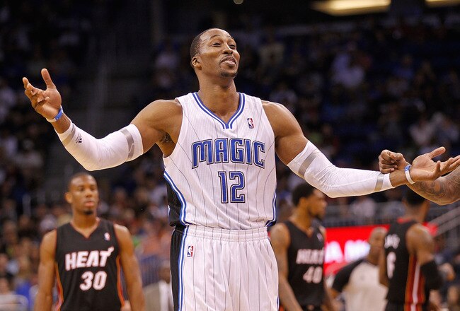 ORLANDO, FL - DECEMBER 21: Dwight Howard #12 of the Orlando Magic argues a call during a preseason game against the Miami Heat at Amway Center on December 21, 2011 in Orlando, Florida. NOTE TO USER: User expressly acknowledges and agrees that, by downloading and/or using this Photograph, User is consenting to the terms and conditions of the Getty Images License Agreement.  (Photo by Mike Ehrmann/Getty Images)