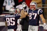 FOXBORO, MA - DECEMBER 06:  (L-R) Aaron Hernandez #85 and Rob Gronkowski #87 of the New England Patriots celebrate a play against the New York Jets at Gillette Stadium on December 6, 2010 in Foxboro, Massachusetts. The Patriots won 45-3. (Photo by Jim Rogash/Getty Images)